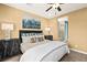 Bedroom with neutral walls, ceiling fan, and ensuite bathroom with a glass door shower at 4220 E Brusca Way, Pahrump, NV 89061