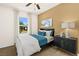 Bedroom featuring a ceiling fan, neutral walls, and a large window with natural light at 4220 E Brusca Way, Pahrump, NV 89061