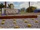 Welcoming community sign surrounded by desert landscaping, with decorative rocks and barrel cacti at 4230 E Brusca Way, Pahrump, NV 89061