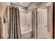 Modern bathroom with a shower featuring white subway tile and a shower curtain at 4566 Ganier Ct # 1125, North Las Vegas, NV 89031