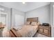 Cozy bedroom with neutral tones, complemented by warm wood accents and a soft carpet at 4566 Ganier Ct # 1125, North Las Vegas, NV 89031