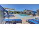 Community pool with lounge chairs and shaded area, perfect for relaxation at 4566 Ganier Ct # 1125, North Las Vegas, NV 89031