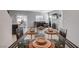 Dining room with tile floors, recessed lighting, and a set table with bowls and decorative placemats at 4566 Ganier Ct # 1125, North Las Vegas, NV 89031