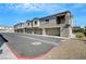 Row of townhomes featuring individual garages and well-maintained landscaping at 4566 Ganier Ct # 1125, North Las Vegas, NV 89031