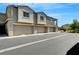 Townhome exteriors featuring individual garages and well-maintained landscaping at 4566 Ganier Ct # 1125, North Las Vegas, NV 89031