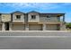 Townhome exteriors featuring individual garages and well-maintained landscaping at 4566 Ganier Ct # 1125, North Las Vegas, NV 89031