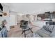 Bright living room featuring tile flooring, recessed lighting, staircase, and a doorway to the exterior at 4566 Ganier Ct # 1125, North Las Vegas, NV 89031