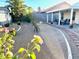 Backyard oasis featuring meticulously landscaped gravel with patio, flowers, and decorative walkway at 470 Como Ct, Henderson, NV 89015