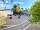 Gravel backyard features mature trees and landscape with stone pathway at 470 Como Ct, Henderson, NV 89015