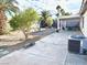 Spacious backyard with covered patio, concrete area, and easy-care landscaping at 470 Como Ct, Henderson, NV 89015