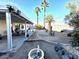 Spacious covered patio and decorative gravel backyard creates a great outdoor living space with meticulous landscaping at 470 Como Ct, Henderson, NV 89015