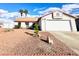 Charming single-Gathering home with a two-car garage and desert landscaping at 470 Como Ct, Henderson, NV 89015