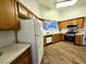 Open-concept kitchen featuring wood cabinets and modern appliances, creating a functional and stylish cooking space at 470 Como Ct, Henderson, NV 89015