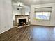 Bright living room with a fireplace and abundant natural light, creating an inviting and cozy atmosphere at 470 Como Ct, Henderson, NV 89015