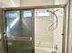 Shower enclosure with glass doors and updated fixtures at 470 Como Ct, Henderson, NV 89015