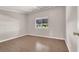 Bright bedroom with wood floors and a large window at 4722 Obannon Dr # D, Las Vegas, NV 89102