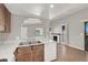 Kitchen with a stainless steel sink, dishwasher and a view of a fireplace at 4722 Obannon Dr # D, Las Vegas, NV 89102