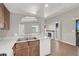 Kitchen with a stainless steel sink, dishwasher and a view of a fireplace at 4722 Obannon Dr # D, Las Vegas, NV 89102