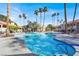 Relaxing community pool area surrounded by swaying palm trees on a sunny day at 4722 Obannon Dr # D, Las Vegas, NV 89102