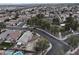 Aerial view of a neighborhood featuring residential homes, streets, and landscaping at 4928 Indigo Gorge Ave, Las Vegas, NV 89131