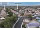 Neighborhood aerial view with nearby amenities like a school, park, and a home address at 4928 Indigo Gorge Ave, Las Vegas, NV 89131