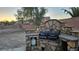 Outdoor kitchen and grill area in backyard with stone surround at 4928 Indigo Gorge Ave, Las Vegas, NV 89131