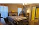 Bedroom with neutral tones, bright window, ceiling fan, and yellow doors at 4928 Indigo Gorge Ave, Las Vegas, NV 89131