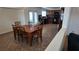 Open-concept dining area featuring tile flooring and ample seating with view of kitchen at 4928 Indigo Gorge Ave, Las Vegas, NV 89131