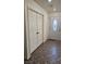 Tiled entryway with white front door and closet with double doors at 4928 Indigo Gorge Ave, Las Vegas, NV 89131