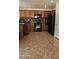 Well-lit kitchen with tile floors and stainless steel appliances at 4928 Indigo Gorge Ave, Las Vegas, NV 89131