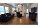 Bright living room with wood flooring, comfortable seating, and lots of natural light at 4928 Indigo Gorge Ave, Las Vegas, NV 89131