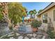 Backyard patio area features lush greenery and ample seating, ideal for outdoor relaxation and entertaining at 5022 Arizo Ct, North Las Vegas, NV 89031