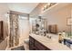 Well-lit bathroom with a shower-tub combo and sleek fixtures at 5022 Arizo Ct, North Las Vegas, NV 89031