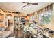 Eat-in kitchen features stainless steel appliances, light wood cabinets, and an adjacent dining area with a large window at 5022 Arizo Ct, North Las Vegas, NV 89031