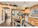 Well-equipped kitchen featuring stainless steel appliances, light wood cabinets, and an eat-in breakfast area at 5022 Arizo Ct, North Las Vegas, NV 89031