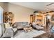 Open living room with comfortable seating and built-in shelving, perfect for relaxing at 5022 Arizo Ct, North Las Vegas, NV 89031