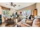 Inviting living room with hardwood floors, dining area, and French doors to the backyard at 5022 Arizo Ct, North Las Vegas, NV 89031