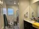 Bathroom with a tiled shower and a large mirror over the sink at 5161 Birchland Manor Ave, Las Vegas, NV 89139