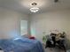 Cozy bedroom featuring a bright window, modern ceiling fan, and space for a desk at 5161 Birchland Manor Ave, Las Vegas, NV 89139