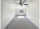 Clean, empty living room featuring neutral carpet, ample natural light, and fresh paint at 5212 Paradise Skies Ave, Las Vegas, NV 89156