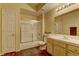 Neutral bathroom featuring a shower-tub combo, wood cabinets, and tile floors at 5250 S Rainbow Blvd # 1121, Las Vegas, NV 89118