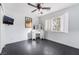 Bright bedroom featuring a vanity, ceiling fan, and a window with shutters at 58 Desert Sunflower Cir, Henderson, NV 89002