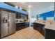 Beautiful kitchen featuring modern appliances, tiled floors, and ample counter space, perfect for cooking at 58 Desert Sunflower Cir, Henderson, NV 89002