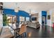 Open-concept living room showcases a large sectional, modern lighting, and seamless flow to dining area at 58 Desert Sunflower Cir, Henderson, NV 89002