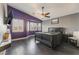 Spacious bedroom featuring a ceiling fan, bay windows, and dark wood floors at 58 Desert Sunflower Cir, Henderson, NV 89002