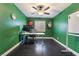 Home office with vibrant green walls, desk space, and natural light at 58 Desert Sunflower Cir, Henderson, NV 89002