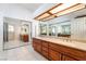 Bathroom featuring double sinks with granite countertop and storage at 60 Reyburn Dr, Henderson, NV 89074