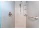 Updated bathroom featuring a tiled shower with handrails and silver fixtures at 60 Reyburn Dr, Henderson, NV 89074