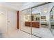 Bathroom featuring a closet, vanity, sink, and double door for privacy at 60 Reyburn Dr, Henderson, NV 89074