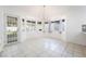 Bright dining area featuring tiled floors, large windows, and a chandelier at 60 Reyburn Dr, Henderson, NV 89074